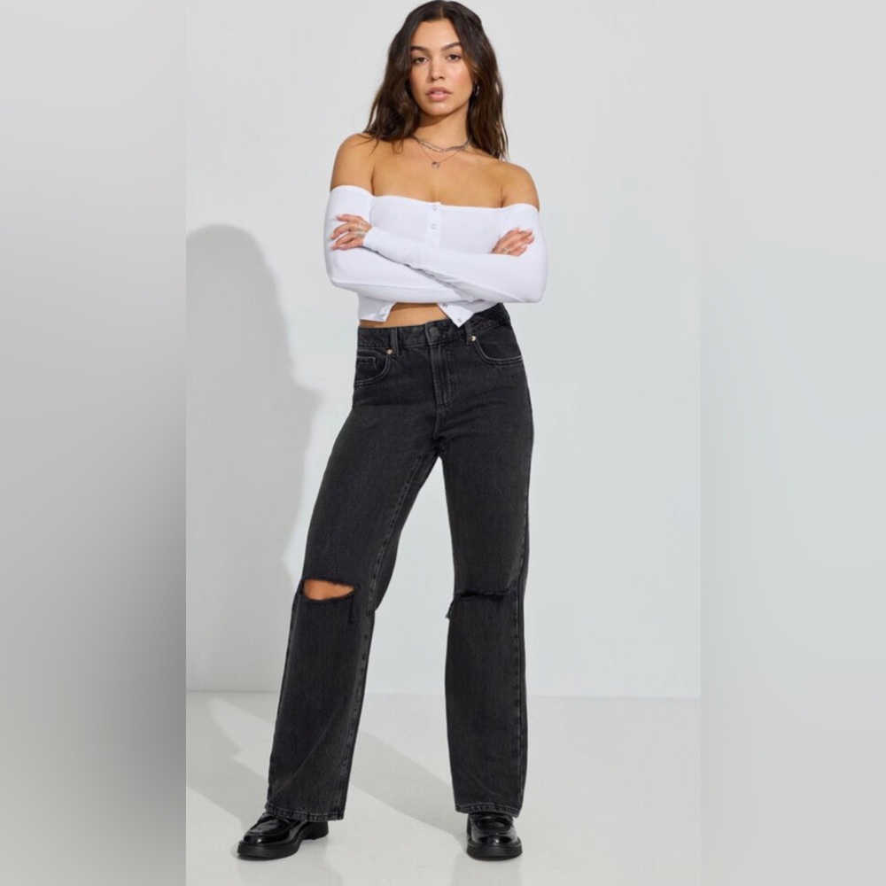 Black straight leg jeans. Small Rips in the knees ( they are meant to there)